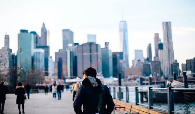 A guy walking alone in NYC