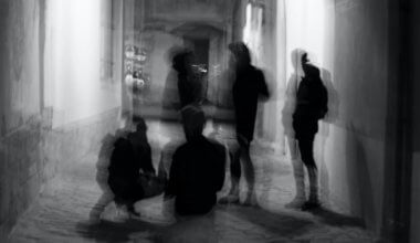 A blurry photo of men hanging out at night