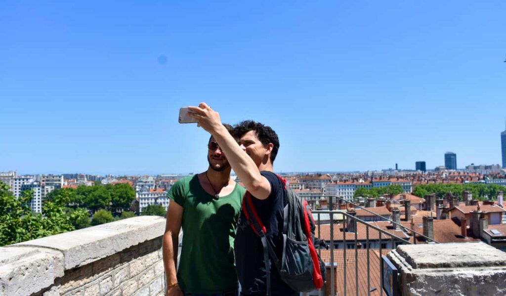 Nomadic Matt posing for a photo with his host in France