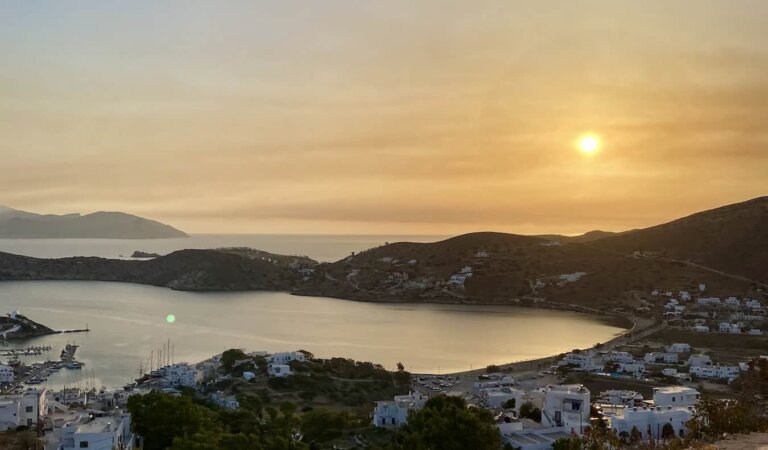 A bright sunset overlooking the beautiful island of Ios, Greece
