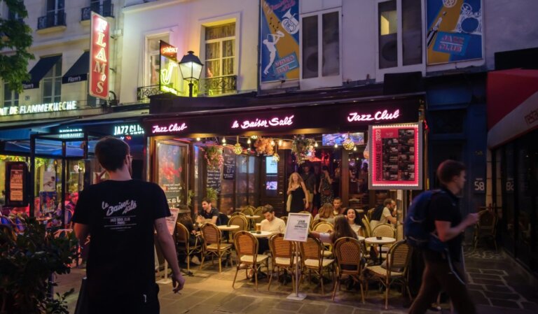 the outside of a jazz club in Paris at night
