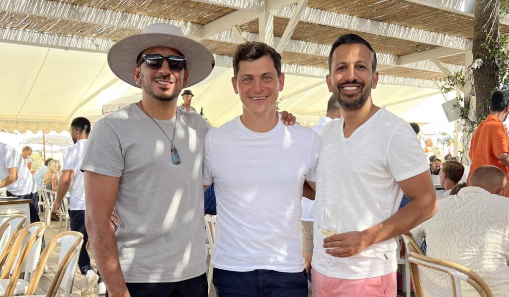 Nomadic Matt standing with two friends in St Tropez