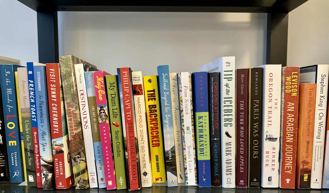 A bunch of travel books on Nomadic Matt's bookshelf