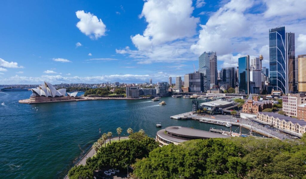 The busy harbor of Sydney, Australia during a sunny summer day