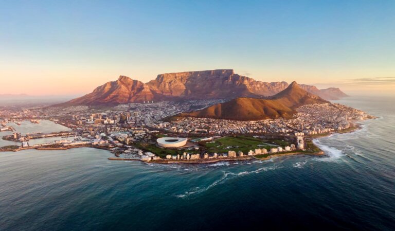 A beautiful aerial view overlooking the coastal city of Cape Town, South Africa at sun down.
