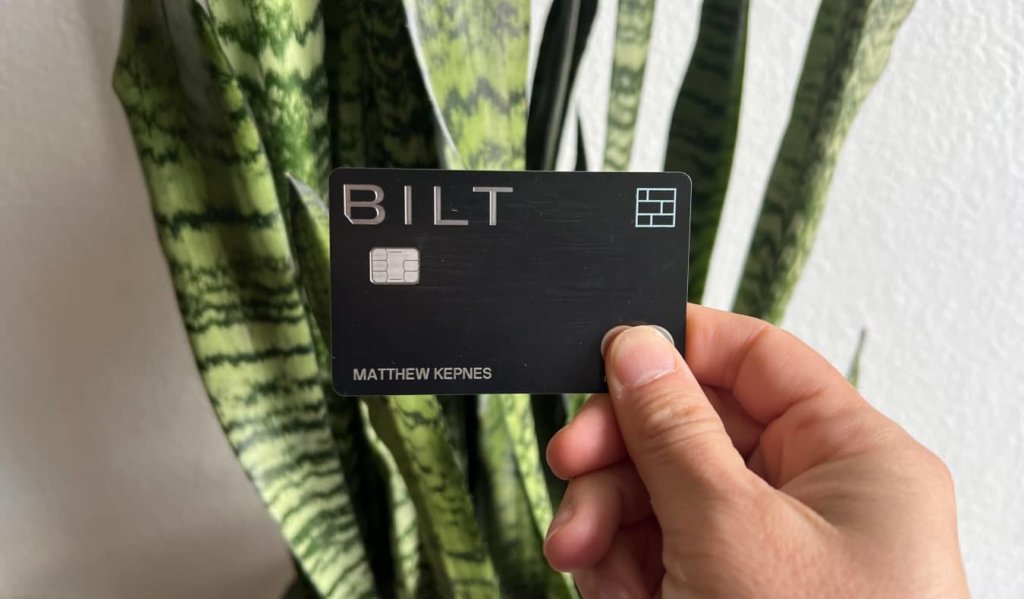 Matt's Bilt Rewards Mastercard being held up in front of a snake plant