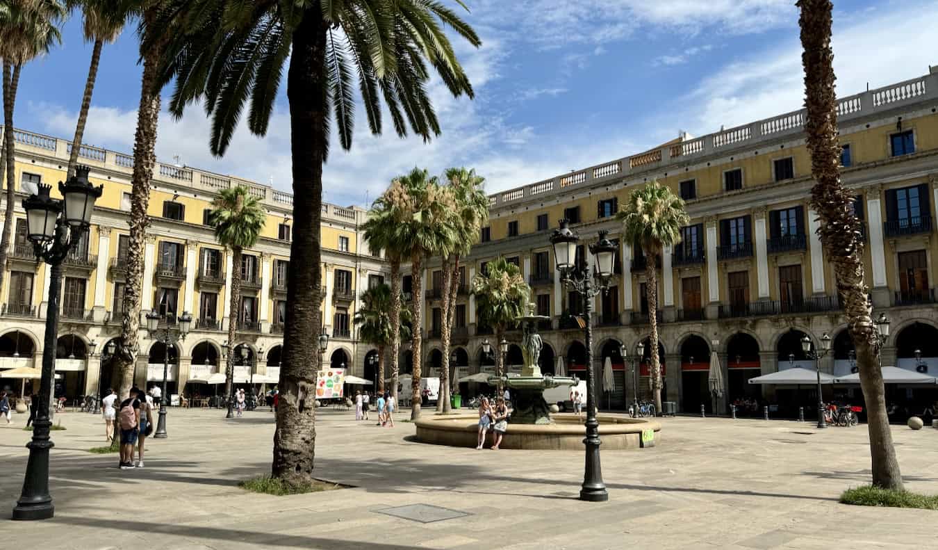The wide open spaces of a historic plaza in sunny Barcelona, Spain